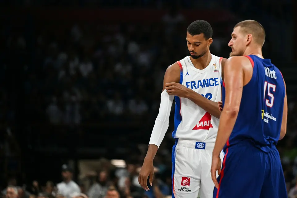 France's #32 Victor Wembanyama (L) and Serbia's #15 Nikola Jokic react during the friendly basketball match between Serbia and France, at the Belgrade Arena, in Belgrade, on August 20, 2026.