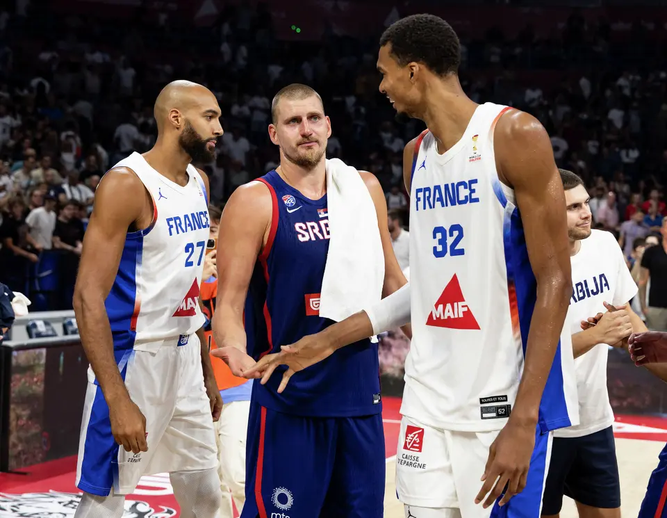 Nikola Jokic (C) of Serbia speaks with Victor Wembanyama (R) and Rudy Gobert (L) of France after the friendly match between Serbia and France at Belgrade Arena on August 20, 2026 in Belgrade, Serbia.