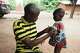 Douro Wonkourou Idrissou, who described himself as a nutrition support member, uses a tape to measure the circumferences of a child's upper arm, in N'dali, northern Benin, Sunday, May. 17, 2026.