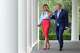 President Donald Trump, right, and first lady Melania Trump walk to attend an event in the Rose Garden of the White House, Thursday, Aug. 20, 2026, in Washington.