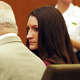 Lindsay Clancy looks at her lawyer Kevin Reddington during her murder trial in Plymouth, Mass., Aug. 20, 2026.