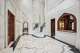 A curving staircase in the foyer of 1708 River Oaks Blvd.