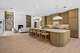 A fluted, pale-wood kitchen island seen in 10725 Marsha Lane.