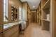 A wood-paneled vanity and dressing suite at 10726 Marsha Lane.