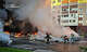 In this photo provided by the Ukrainian Emergency Service, cars burn as firefighters try to put out a fire following a Russian drone attack in Kyiv region, Ukraine, Friday, Aug. 28, 2026. (Ukrainian Emergency Service via AP)