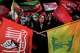 Pro-government demonstrators wave flags including a flag of Lebanon's militant Hezbollah group, right, during a gathering in a square in Tehran, Wednesday, Aug. 26, 2026.