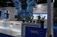 FILE - Workers at the booth for Chinese DRAM producer ChangXin Memory Technologies, also known as CXMT, wait for visitors at the 21st China International Semiconductor Expo in Beijing, Nov. 20, 2024.