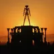FILE: “The Man” is silhouetted against a morning sunrise in Nevada’s Black Rock Desert.