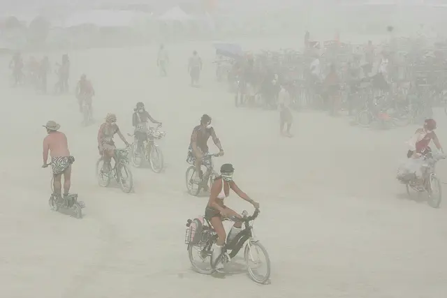 FILE: Burning Man festival participants endure a dust storm on the playa within the Black Rock Desert in Gerlach, Nev.