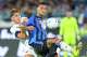 Atalanta's Gianluca Scamacca, right, fights for the ball with Bologna's Eivind Helland, left, during the Serie A soccer match between Atalanta and Bologna in Bergamo, Italy, Monday, Aug. 31 , 2026. (Spada/LaPresse via AP)