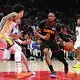 FILE: Jonathan Kuminga of the Atlanta Hawks drives to the basket against the Golden State Warriors during the second quarter at State Farm Arena on March 21, 2026, in Atlanta.
