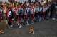 Children line up for their national anthem in the school courtyard where a stray dog sits by on the first day back to school in Minas, Cuba's Havana province, Tuesday, Sept. 1, 2026.