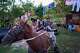 The Barroso family travels by horse-drawn carriage as they head to school for their two daughters' first day back to classes in Minas, Cuba's Havana province, Tuesday, Sept. 1, 2026.