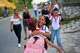 Girls hug as they arrive to school for their first day back to classes in Minas, Cuba's Havana province, Tuesday, Sept. 1, 2026.