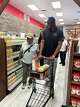 Myles Turner, the Bedford native and NBA star (right), accompanies Alfonso Tippie as he selects groceries at Empowering the Masses’ food pantry at 3220 Samuell Blvd. on Sept. 1, 2026.