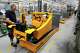 Employees at forklift and warehouse manufacturer Jungheinrich work on the assembly line in Moosburg, Germany, Tuesday, Aug. 25, 2026.