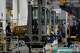 Employees at forklift and warehouse manufacturer Jungheinrich work on the assembly line in Moosburg, Germany, Tuesday, Aug. 25, 2026.