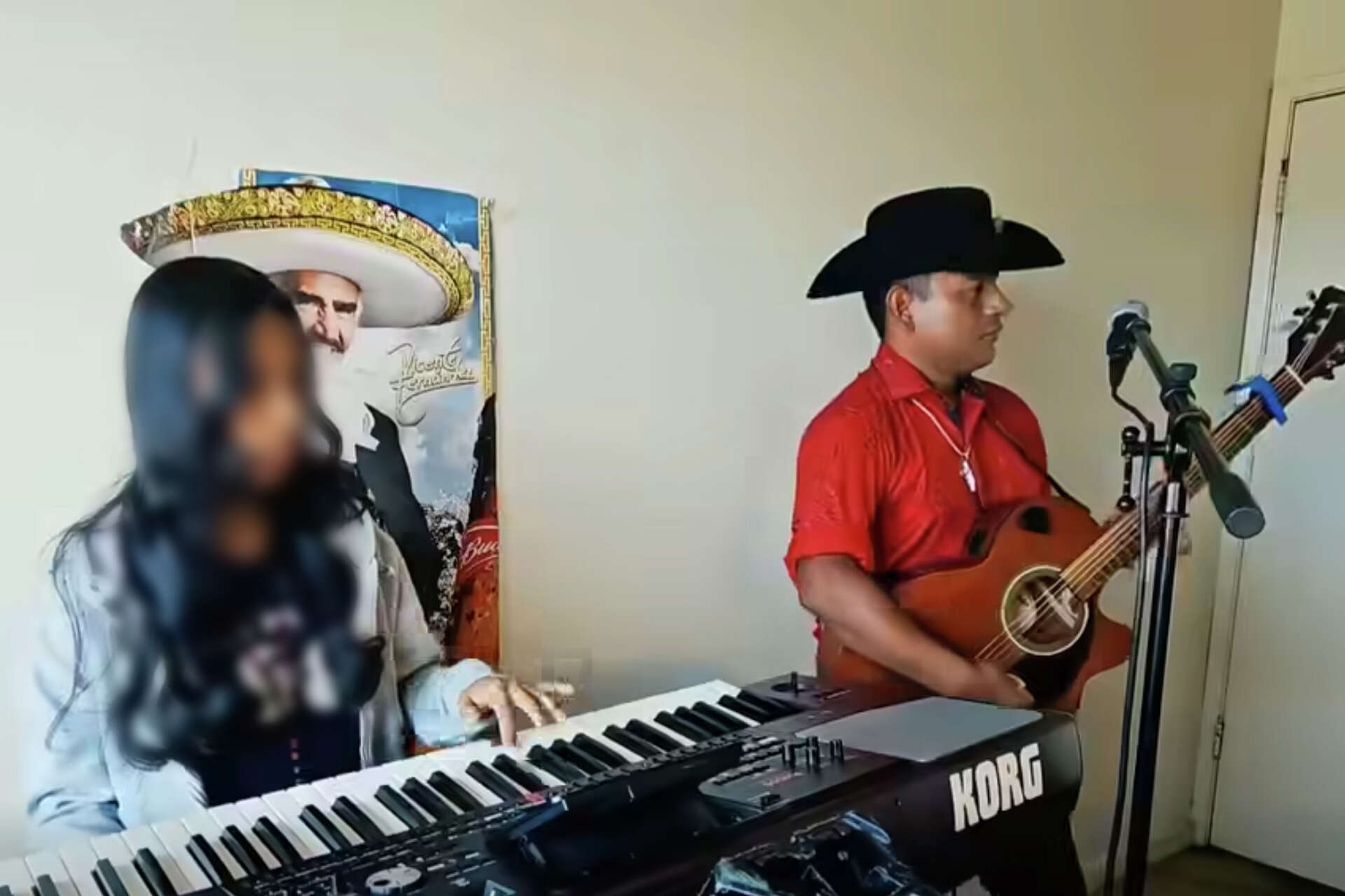 Sergio Galvez Perez performs with a teen girl for his musical act, El Águila Real y Su Ritmo Sabroso.