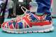 A member wears shoes in Union Flag colours during the Reform party's annual conference at the National Exhibition Centre in Birmingham, England, Friday, Sept. 4, 2026.