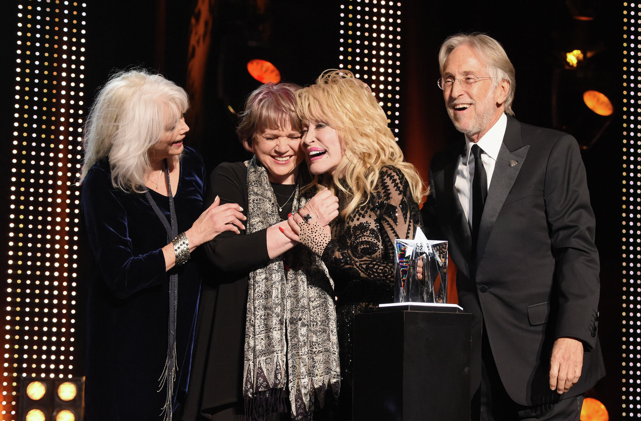 Dolly Parton's legacy shines through music, movies and literacy