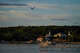 A bird flies by as the sun sets in Ephraim, Door County, Wisconsin.