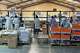 Workers assemble fuel-efficient cookstoves at BURN, a manufacturer of clean cooking appliances, in Kiambu, Kenya, on July 31, 2026.