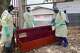 Health workers who are members of the safe and dignified burial team disinfect a coffin to bury Abineno Justine, a 38 year old woman who died of the Ebola virus, in Bunia, Congo, Friday, Sept. 4, 2026.