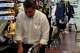 María del Socorro Hernandez, right, and her grandson Martin Hernandez III work together at Martin Tailors, their family’s longtime tailor shop, in Houston on Tuesday, Sept. 1, 2026.