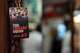 A VIP pass from the premiere of “The Chicano Squad” hangs among memorabilia at Martin Tailors in Houston on Tuesday, Sept. 1, 2026. The Hernandez family tailored suits for members of the Houston Police Department unit that became known as the Chicano Squad.