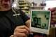 Blanca Hilda Hernandez holds a Polaroid showing the first Martin Tailors shop in Houston on Tuesday, Sept. 1, 2026.