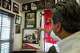 Martin Hernandez III points to a photograph of his grandfather, Martin Hernandez Sr., during his military service at Martin Tailors in Houston on Tuesday, Sept. 1, 2026.