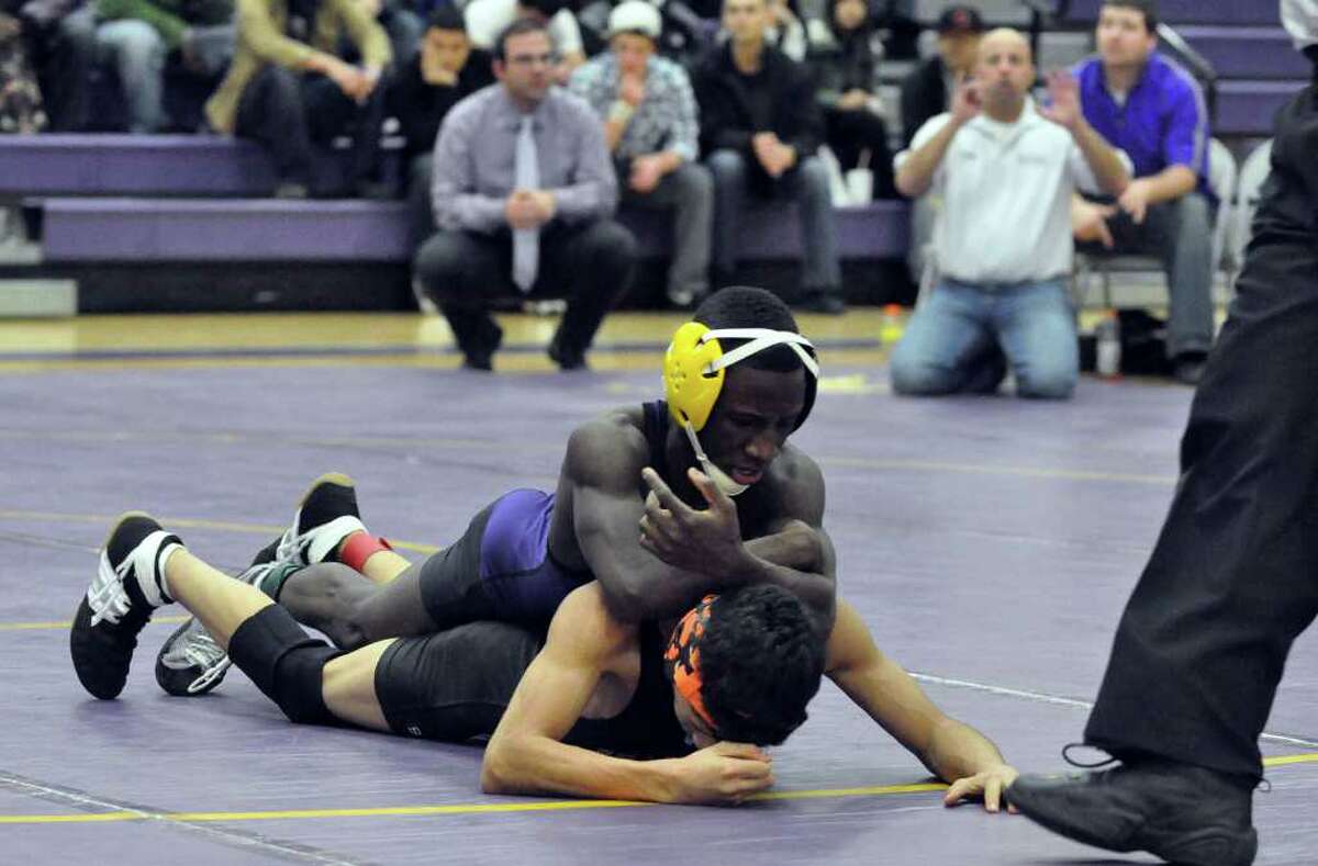 Westhill's Pascal Medo and Stamford's Jose Marriquin wrestle in the 112 weight class during the boys wrestling match at Westhill on Thursday, Dec. 23, 2010.