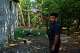 Liexer De La Cruz interacts with his chickens at home in Minas, Cuba's Havana province, Friday, Sept. 4, 2026.