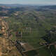 The Napa Valley looking south toward Yountville and Rutherford is viewed from the air on September 22, 2016, near St. Helena, California. Warm weather plays an important role in attracting thousands of tourists to the area during the fall Wine Country grape harvest.