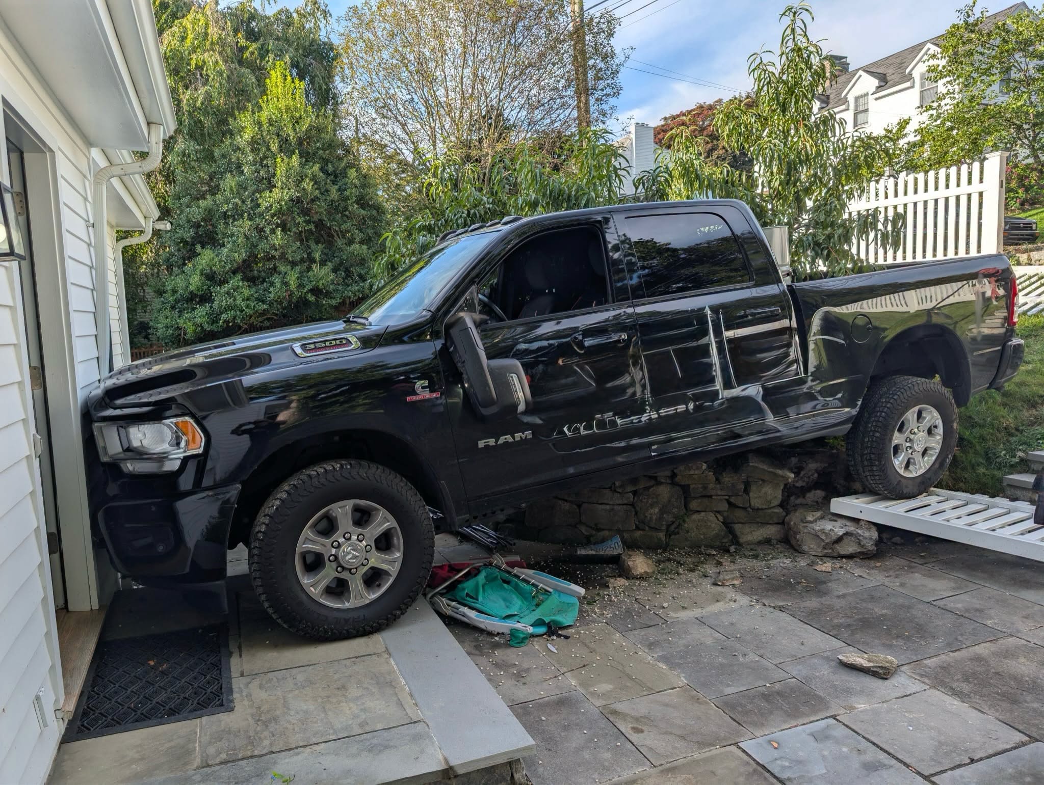 Pickup truck crashes into Westport residence, fire department says