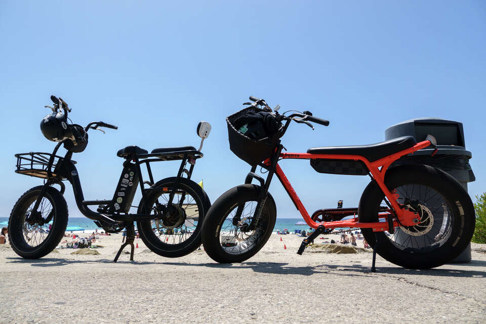 Electric bikes are parked on a sidewalk at Salt Creek Beach on May 9, 2026, in Dana Point, Calif.
