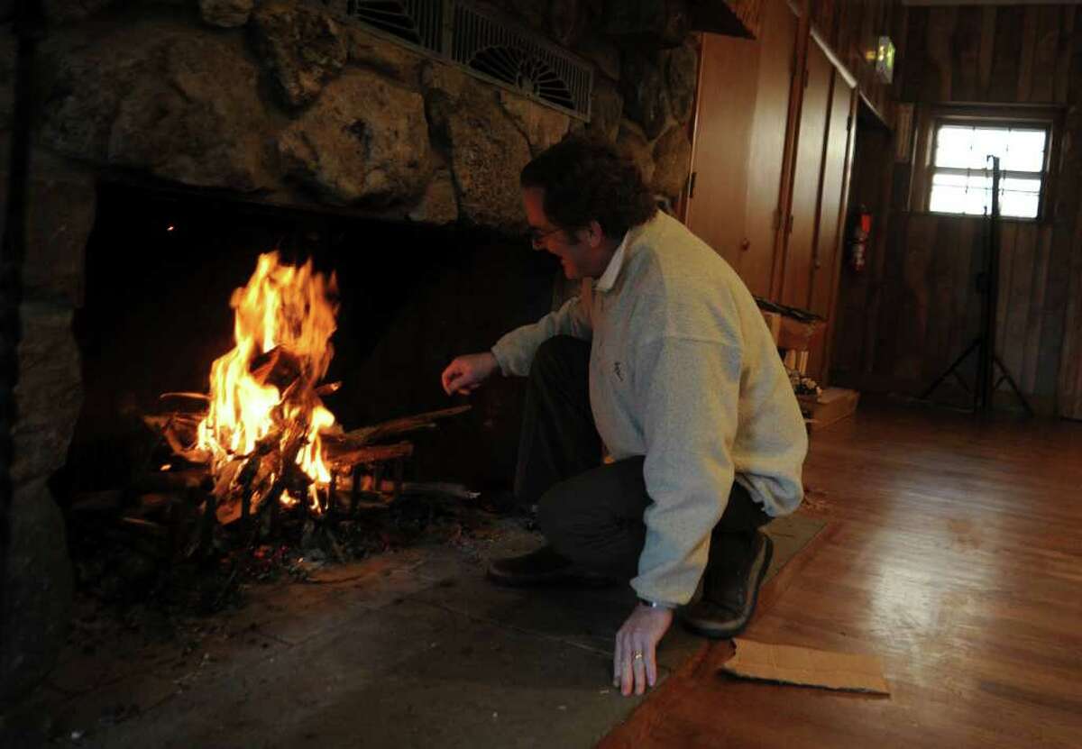 Mike Robertson, scout executive of the Greenwich Scouting council, builds a fire prior the announcement of a collaboration between the Boy Scouts and Abilis, at Camp Seton, on Monday, Dec. 20, 2010.