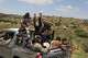 Yemeni civilians celebrate while riding in the back of a pickup truck in the Bani Matar district, Yemen, Saturday, Sept. 12, 2026, as they follow a convoy carrying Houthi prisoners freed in Mokha on its way to Sanaa following the Houthi takeover of the southern Red Sea port city.