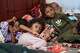 Displaced Yemenis rest at a temporary shelter in the Dar Saad district of Aden, Yemen, Saturday, Sept. 12, 2026, after fleeing Houthi attacks in the western coastal cities of al-Khokha and Mokha.