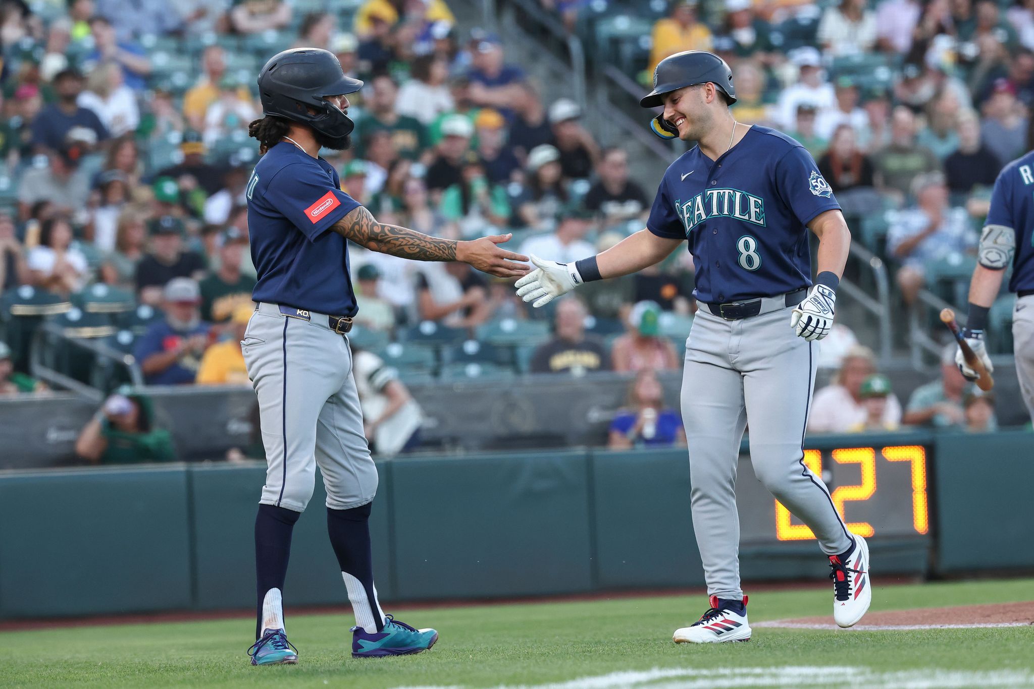 Mariners pound Athletics 19-1 with 5 home runs, 23 hits