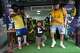 Influencer Narutinho, center, dances with Spain's tourist Ricard Sastre, right, at the Rocinha favela in Rio de Janeiro, on Sept. 2, 2026.