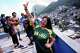 Italian tourist Edda Di Dato, wearing a Brazil's jersey, strikes a pose at a terrace in the Rocinha favela in Rio de Janeiro, on Sept. 2, 2026.