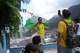 A tourist wearing a jersey in Brazilian colors poses for a photo at the Rocinha favela in Rio de Janeiro, on Sept. 2, 2026.