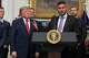 FILE - Kraken co-CEO Arjun Sethi speaks as President Donald Trump listens during a meeting with technology leaders in the Roosevelt Room of the White House, Aug. 19, 2026, in Washington.