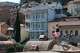 A 28-year-old digital content marketer who recently moved out of Russia takes photos in the Old Town in Tbilisi, Georgia, Saturday, Sept. 5, 2026. He asked not to be identified because of security concerns.