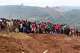 People attend a burial ceremony for school children who died in a fire that swept through two schools in the city of Bukavu, eastern Congo, Monday, Sept. 14, 2026.