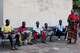 Young men and boys who fled drought in South Sudan sit alongside a chief in Torit, the capital of Eastern Equatoria state, South Sudan, Friday, Aug. 14, 2026.