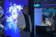 A visitor stands near a display about AI during the World AI Conference in Shanghai, China on July 17, 2026.