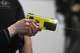 A reporter fires one of the new Axon Taser 10 tools now issued to state police members during a news conference at the state police academy in Meriden, Conn., on March 4, 2026.