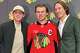 In this photo taken with a smartphono, Chicago Blackhawks players, from left, Patrick Kane, Connor Bedard and Tyler Bertuzzi pose during a news conference introducing Bedard as the new captain of the NHL hockey club, Tuesday, Sept. 15, 2026, in Chicago.